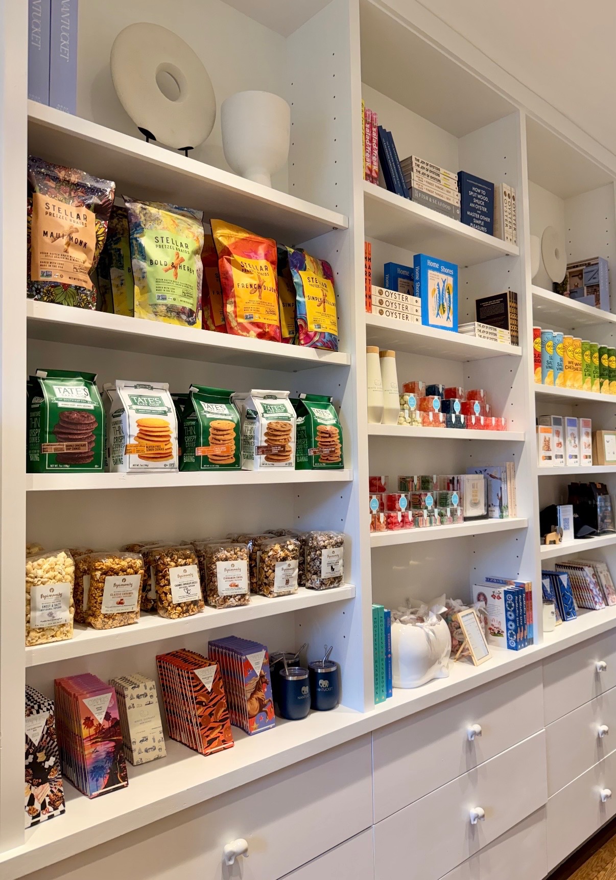 Completed Nantucket shelves with food, books, gifts, and accessories organized into cohesive displays