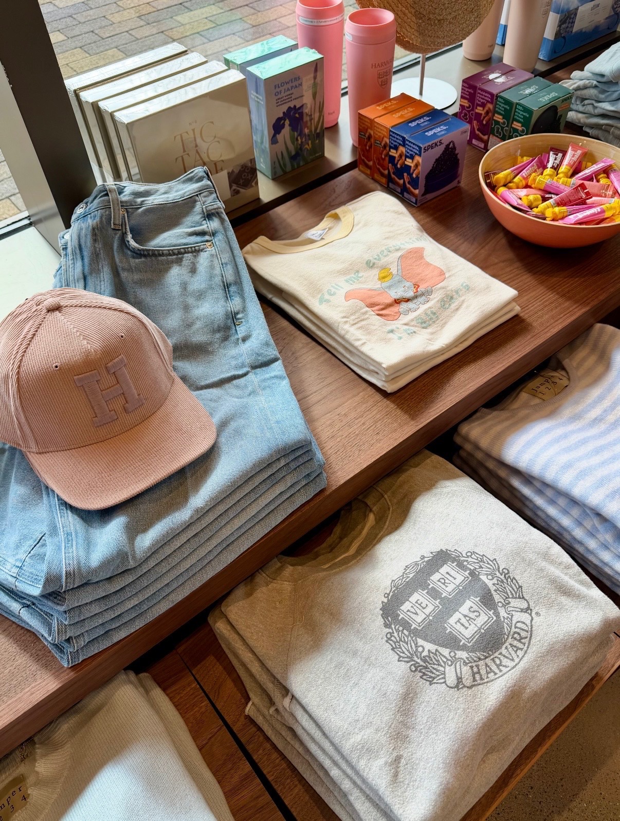 Completed Harvard display with apparel, accessories, books, gifts, and colorful tabletop merchandise