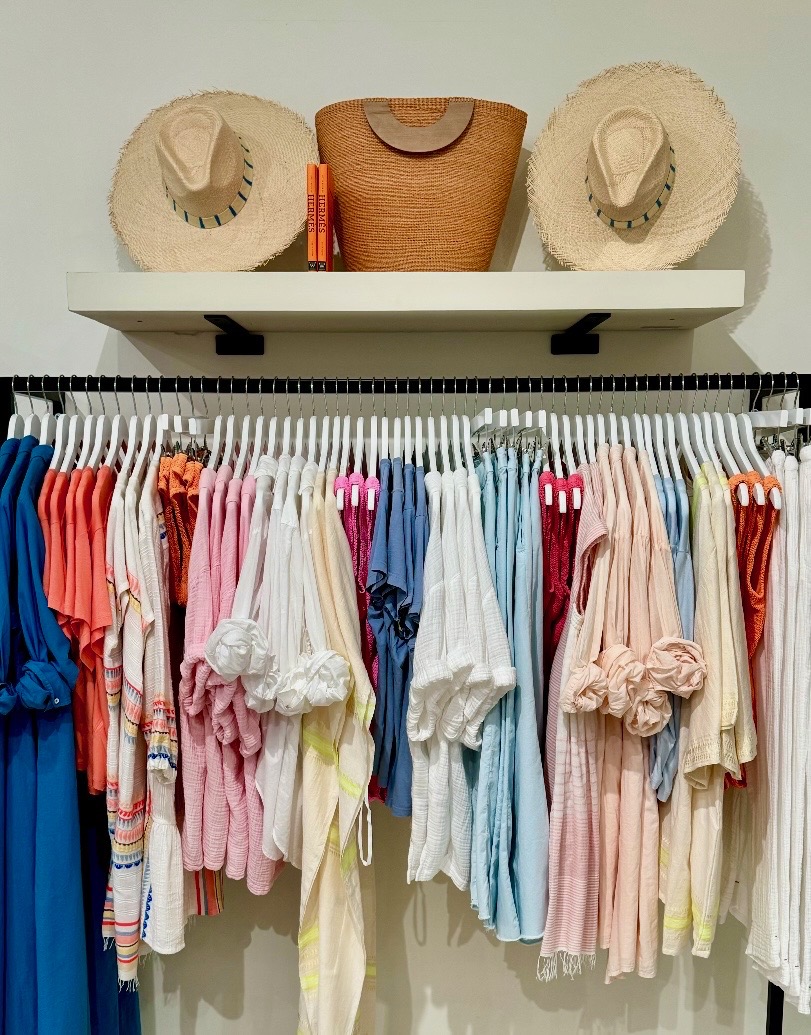 Coordinated colorful resort apparel and straw hats displayed at The Ritz-Carlton Kapalua